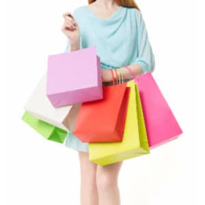 woman holding pastel colored shopping bags