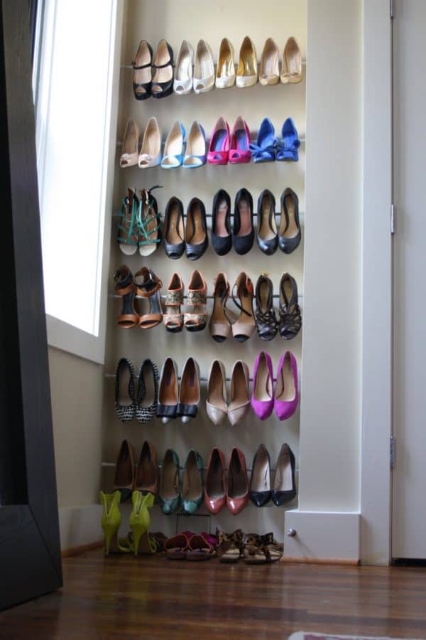 bedroom organization ideas-using tension rods for shoe storage in bedroom