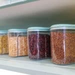 clear containers filled with dry goods in pantry